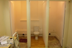 old toilettes stripped bare, new units going in.